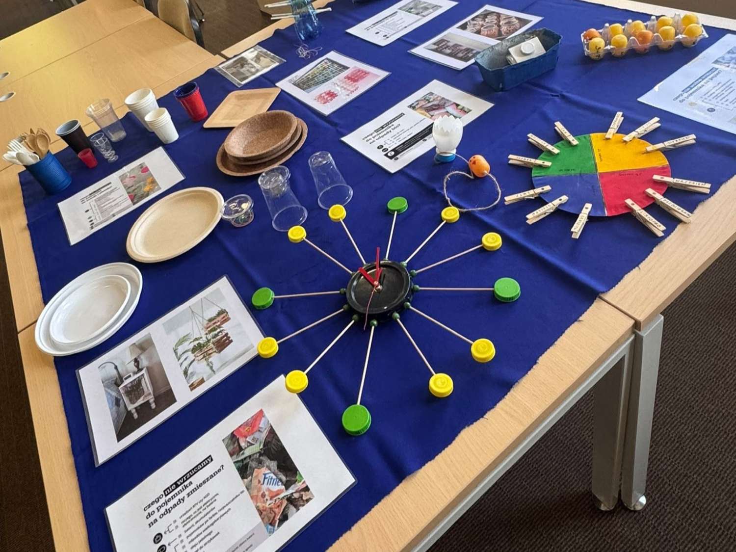 Educational stand at the Olsztyn Days of Science and Art with materials for experiments and scientific demonstrations.